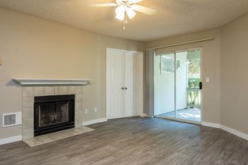 Three Bedroom | Living Room with Fireplace and Patio